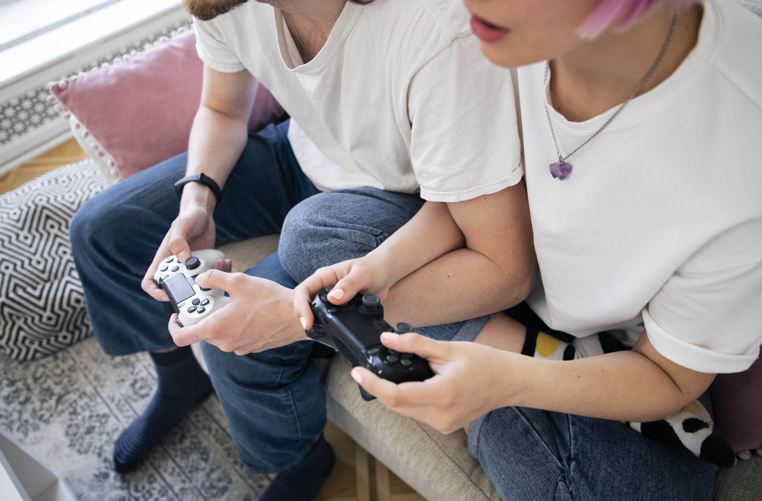 cute couple playing videogames couch 2 scaled